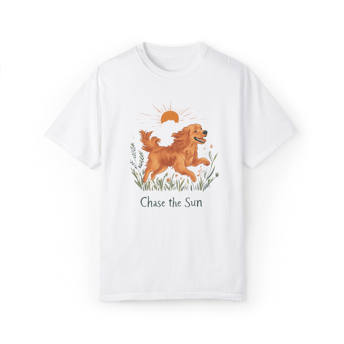 A white T-shirt featuring an illustration of a running golden retriever with a warm sun and wildflowers in the background, accompanied by the text "Chase the Sun," radiating energy and optimism.