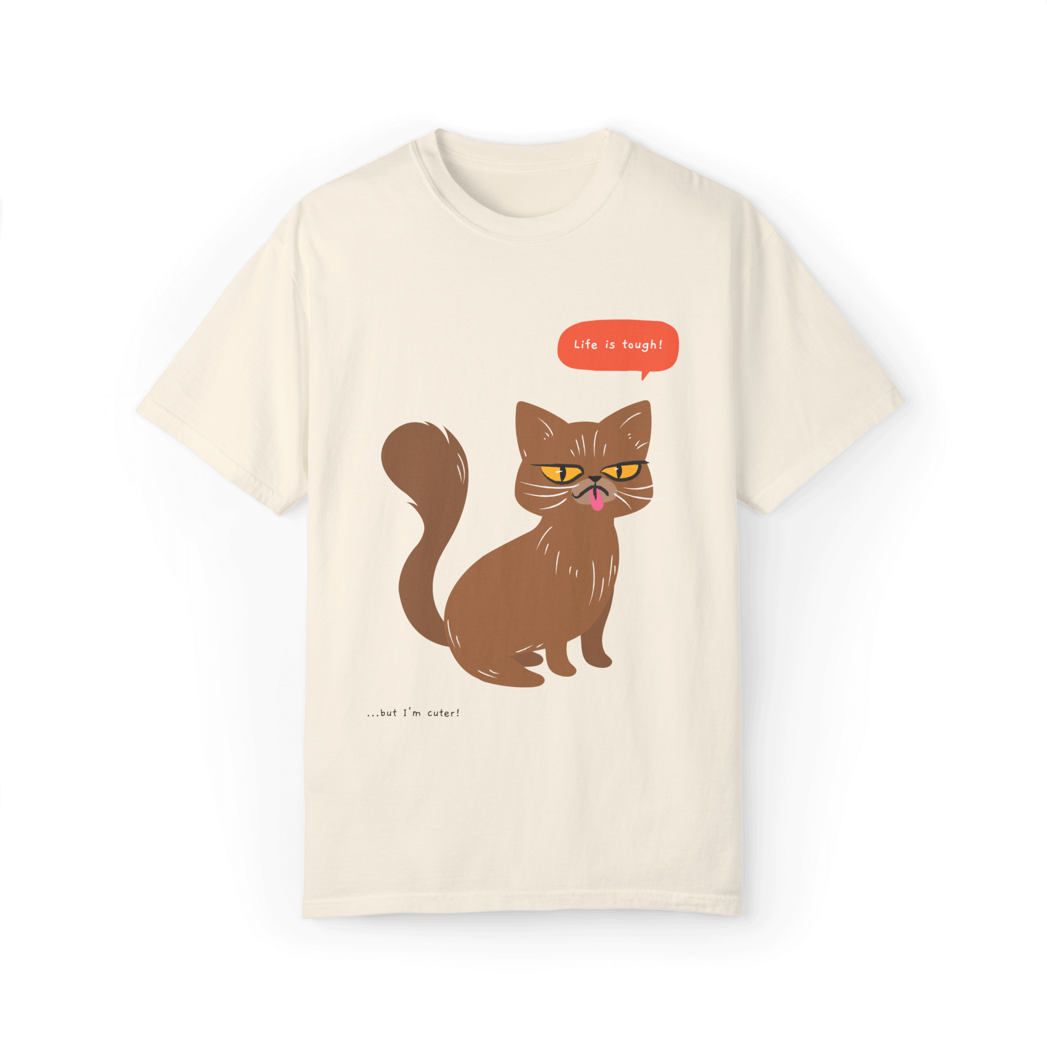 Beige T-shirt featuring a brown cat illustration with the phrase 'Life is tough!' and a humorous note '...but I'm cuter!