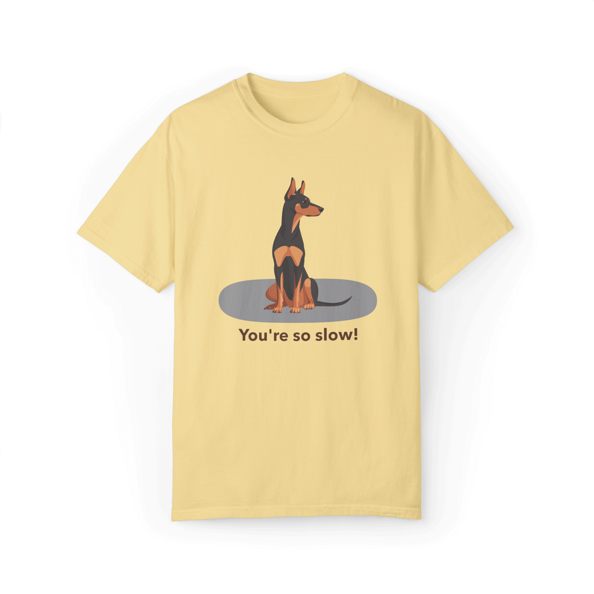 A pale yellow T-shirt featuring a cartoon Doberman illustration with the humorous text 