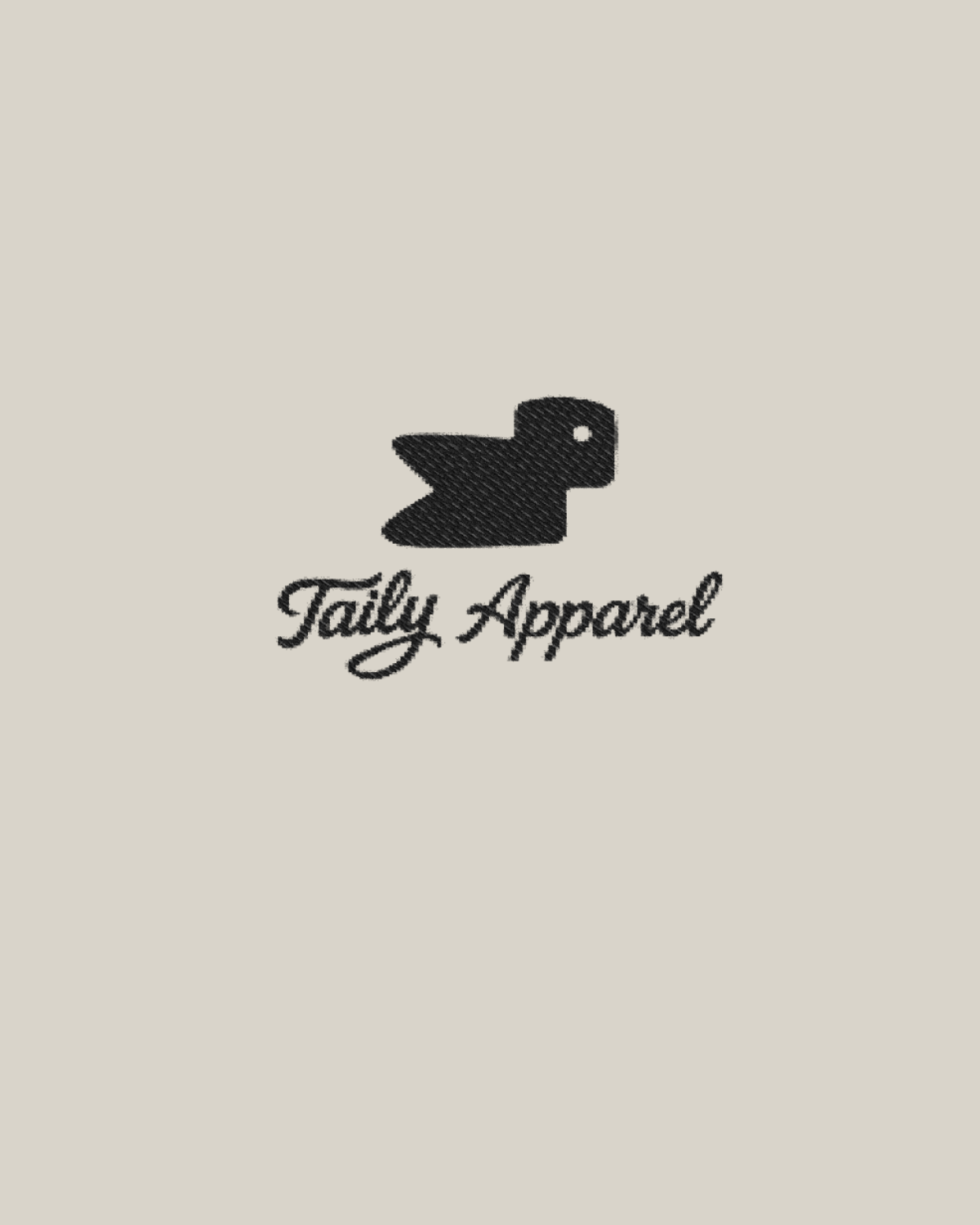 Taily Bird embroidered hoodie detail featuring Taily Apparel logo with black bird design on a neutral background.