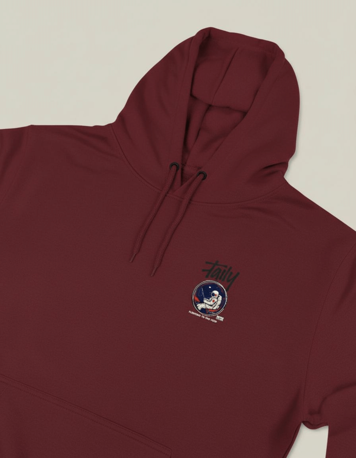 Taily Space Club Streetwear Graphic Hoodie in burgundy featuring an astronaut logo on chest.