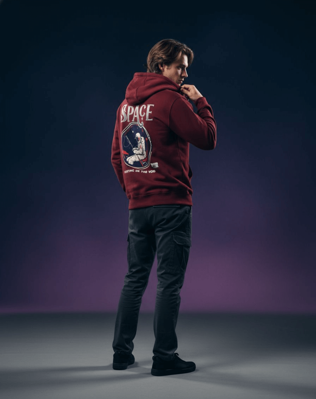 Taily Streetwear Graphic Hoodie in burgundy featuring astronaut graphic and the phrase 'Floating in the Void'.