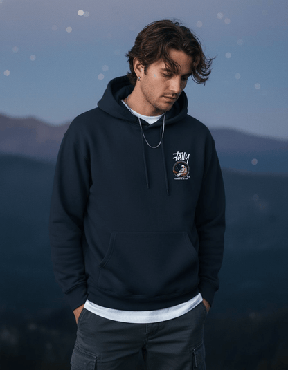 Young man wearing Taily Space Club navy Streetwear Graphic Hoodie outdoors.