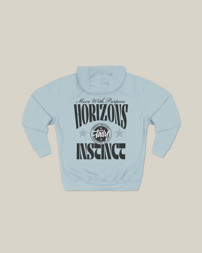 Taily Horizons Instinct Hoodie – Blue Mist with bold message 'Move With Purpose' and Taily logo on back.