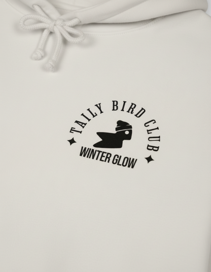 Taily Bird Club Winter Glow Hoodie – Bone with small Winter Glow emblem on the front.