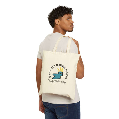 Taily Bird Bold Canvas Tote Bag – Natural / Blue Bird worn by model, showcasing playful design and sturdy handle.