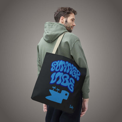 SUMMER VIBE tote bag on a model, featuring all-over graphic print and a fun blue design.