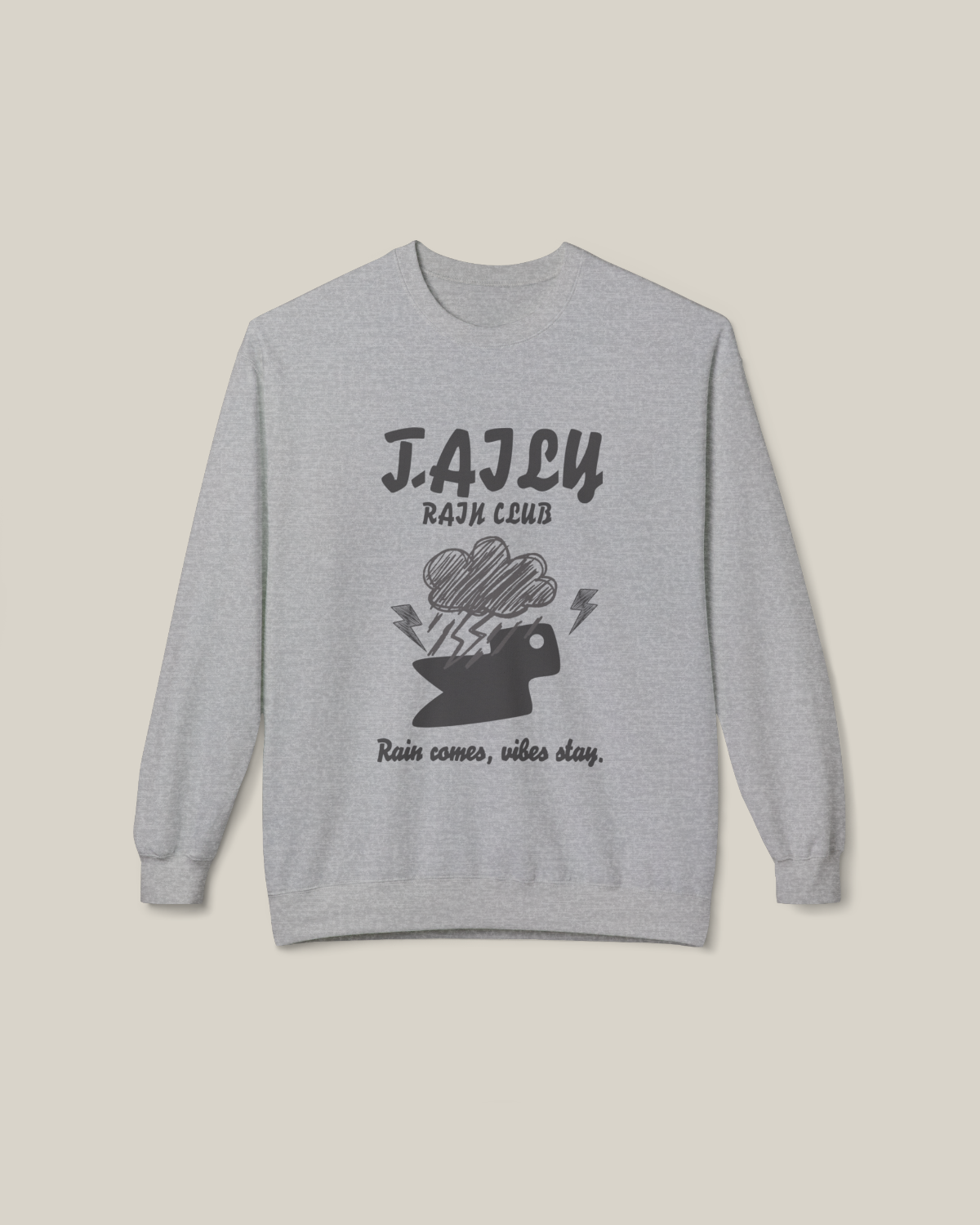 Taily Rain Club sweatshirt in Sport Grey featuring cloud and lightning design with "Rain comes, vibes stay" phrase.