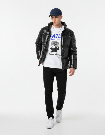 Model wearing Taily Rain Club sweatshirt in white, paired with a black puffer jacket and black jeans, showcasing streetwear style.
