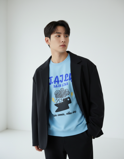 Model wearing Taily Rain Club sweatshirt in Sky with cloud and lightning design.