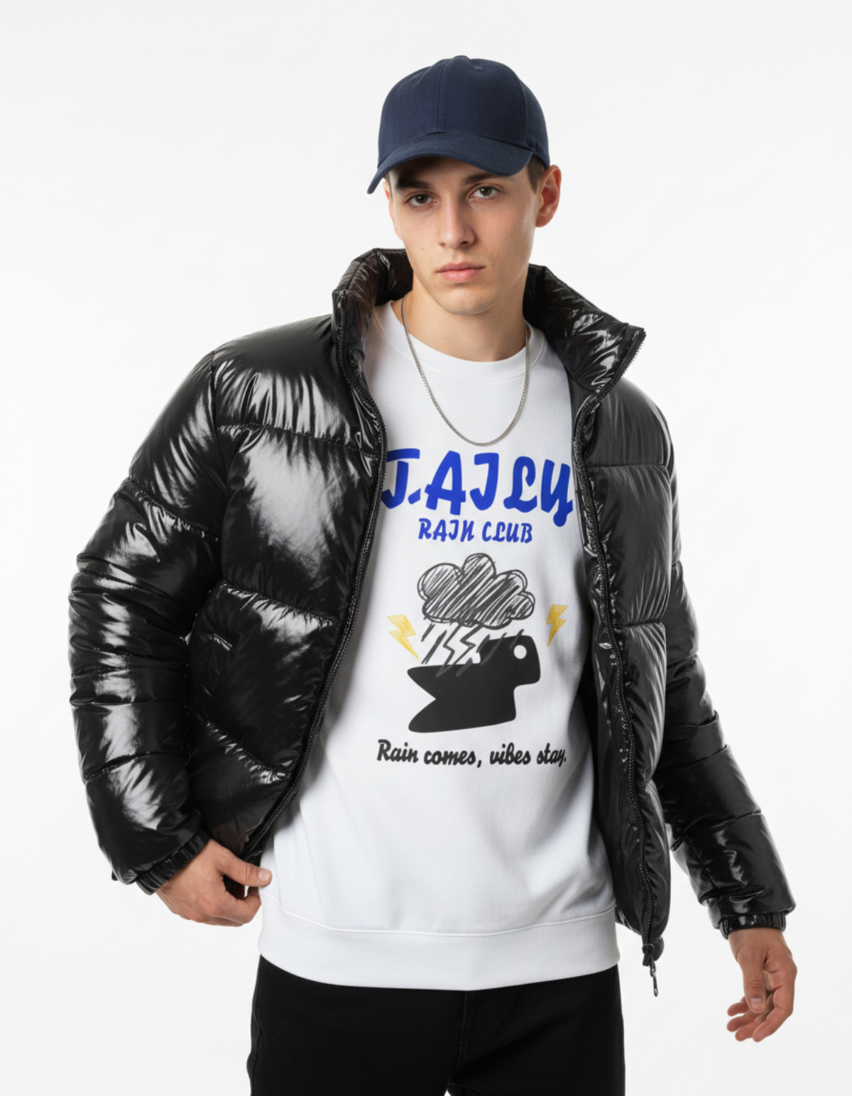 Model wearing Taily Rain Club sweatshirt in white with a black puffer jacket, showcasing storm cloud design.