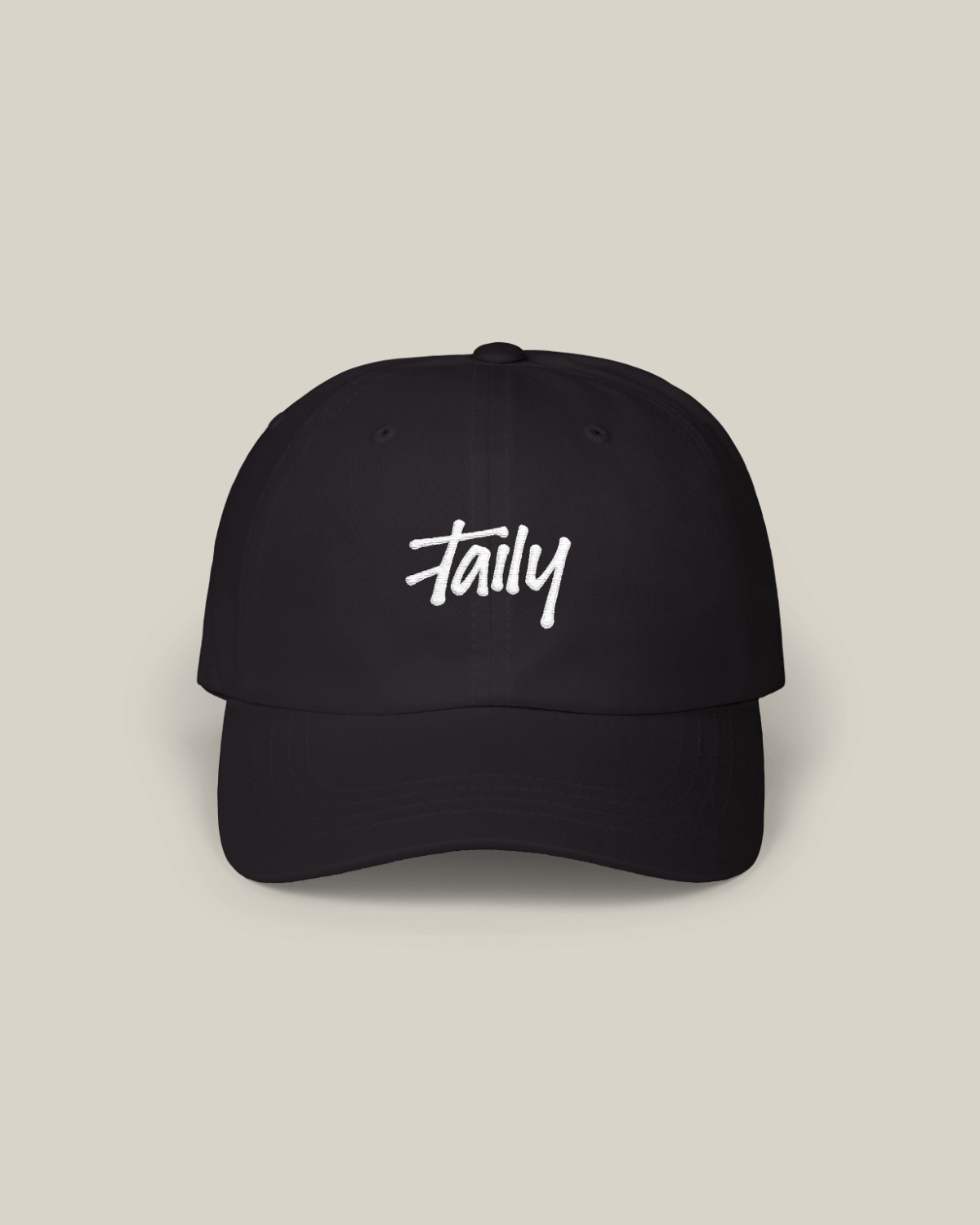 Taily Classic Dad Cap in black cotton featuring a stylish embroidered logo on a minimal design.