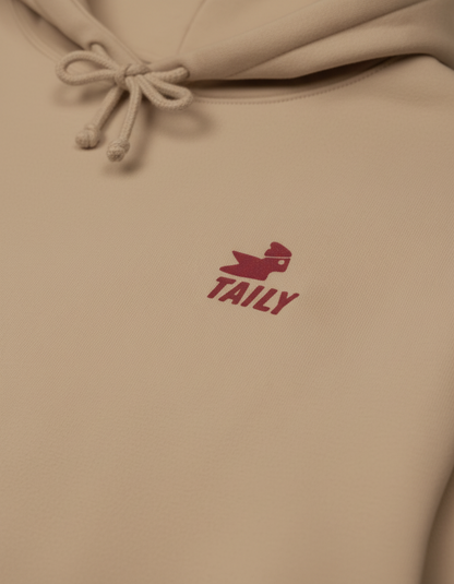 Taily Bird Parkland Hoodie in Sandstone featuring a logo detail.