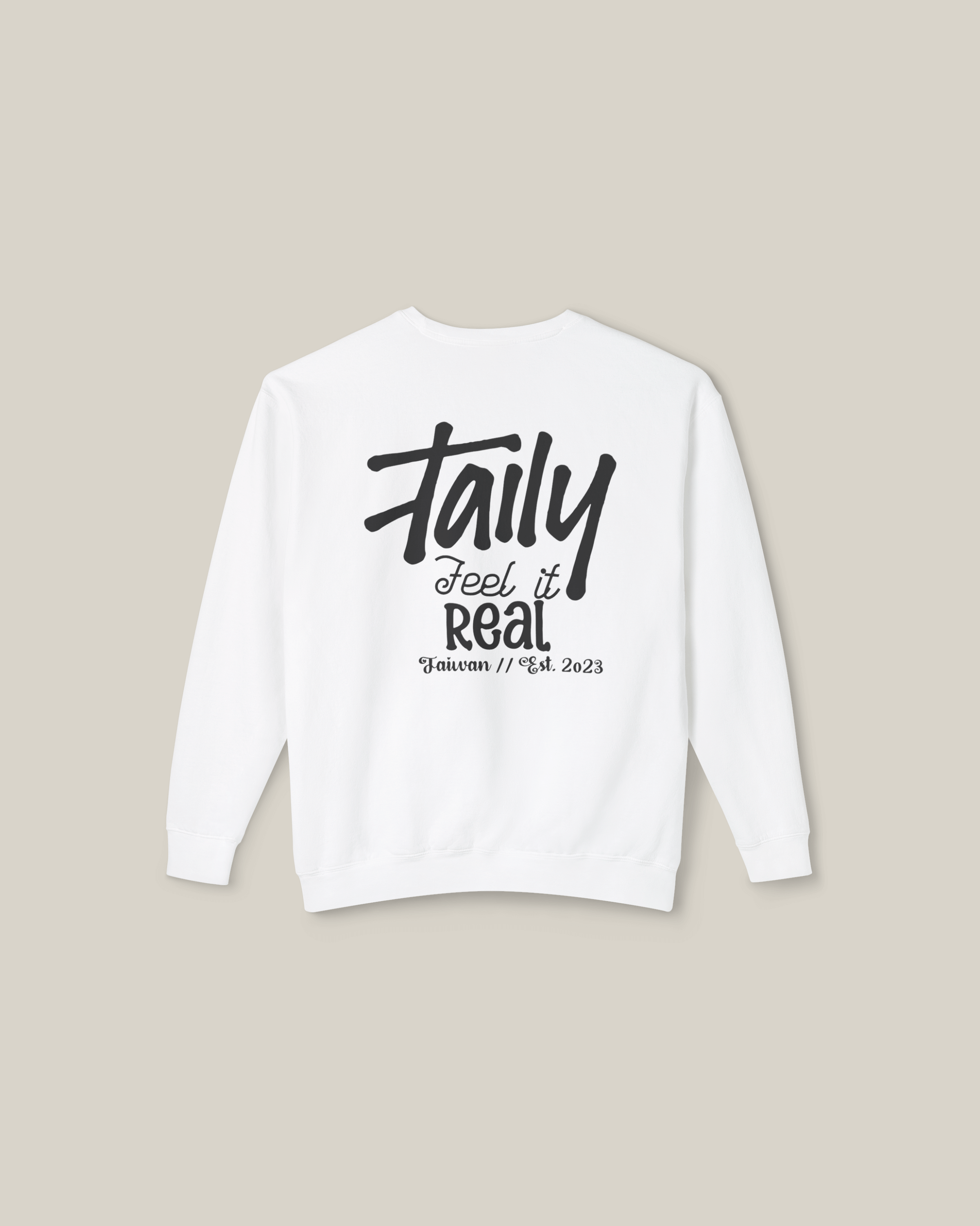 Taily Feel It Real sweatshirt in white with bold lettering and chest logo, perfect for streetwear style.