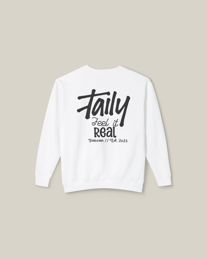 Taily Feel It Real sweatshirt in white with bold lettering and chest logo, perfect for streetwear style.