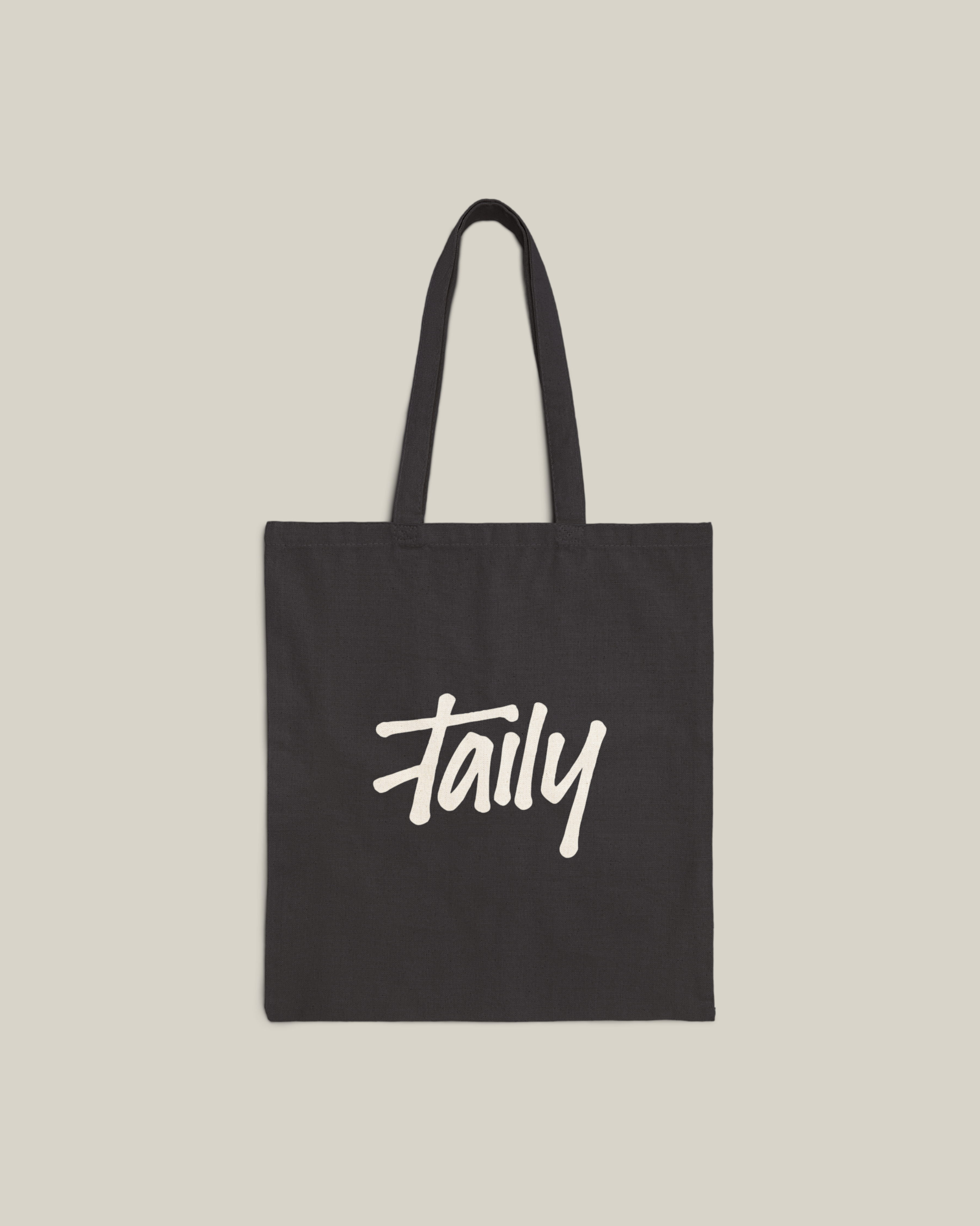Taily Bird Bold Canvas Tote Bag in black featuring bold logo design for stylish everyday use.