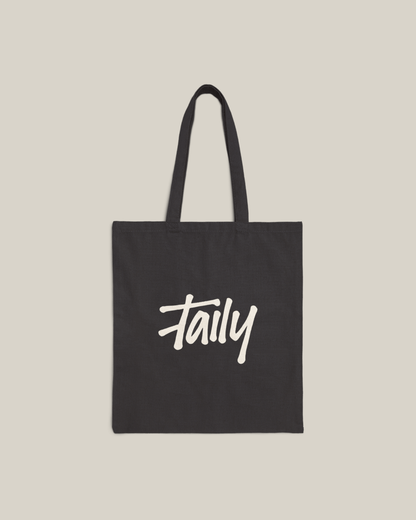 Taily Bird Bold Canvas Tote Bag in black featuring bold logo design for stylish everyday use.