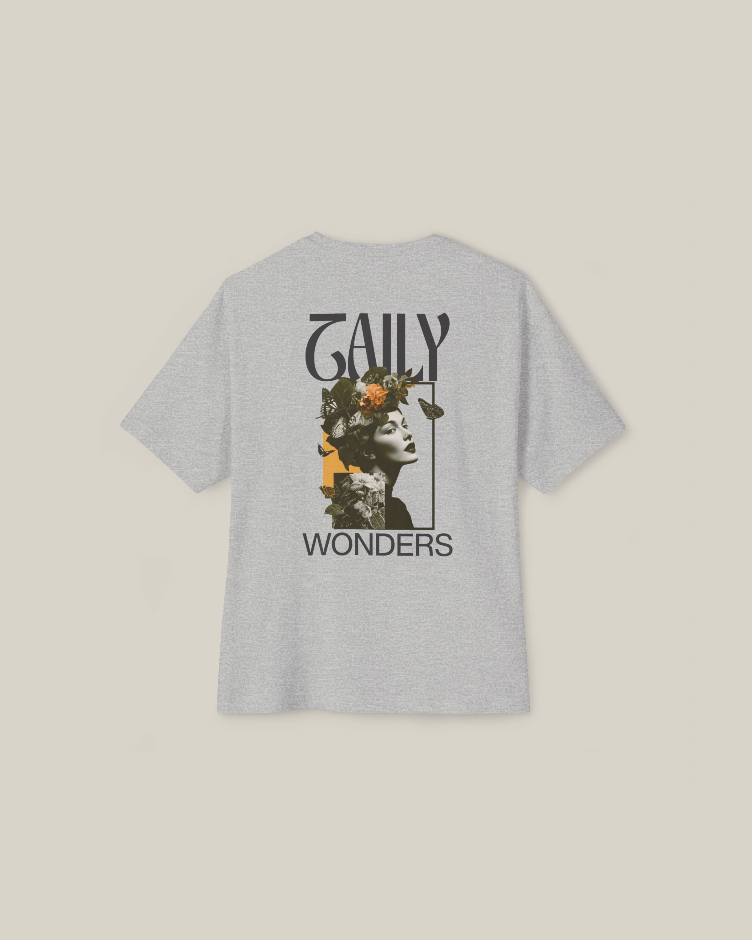 Heather grey vintage boxy tee featuring a striking floral portrait design on the back by Taily Wonders.