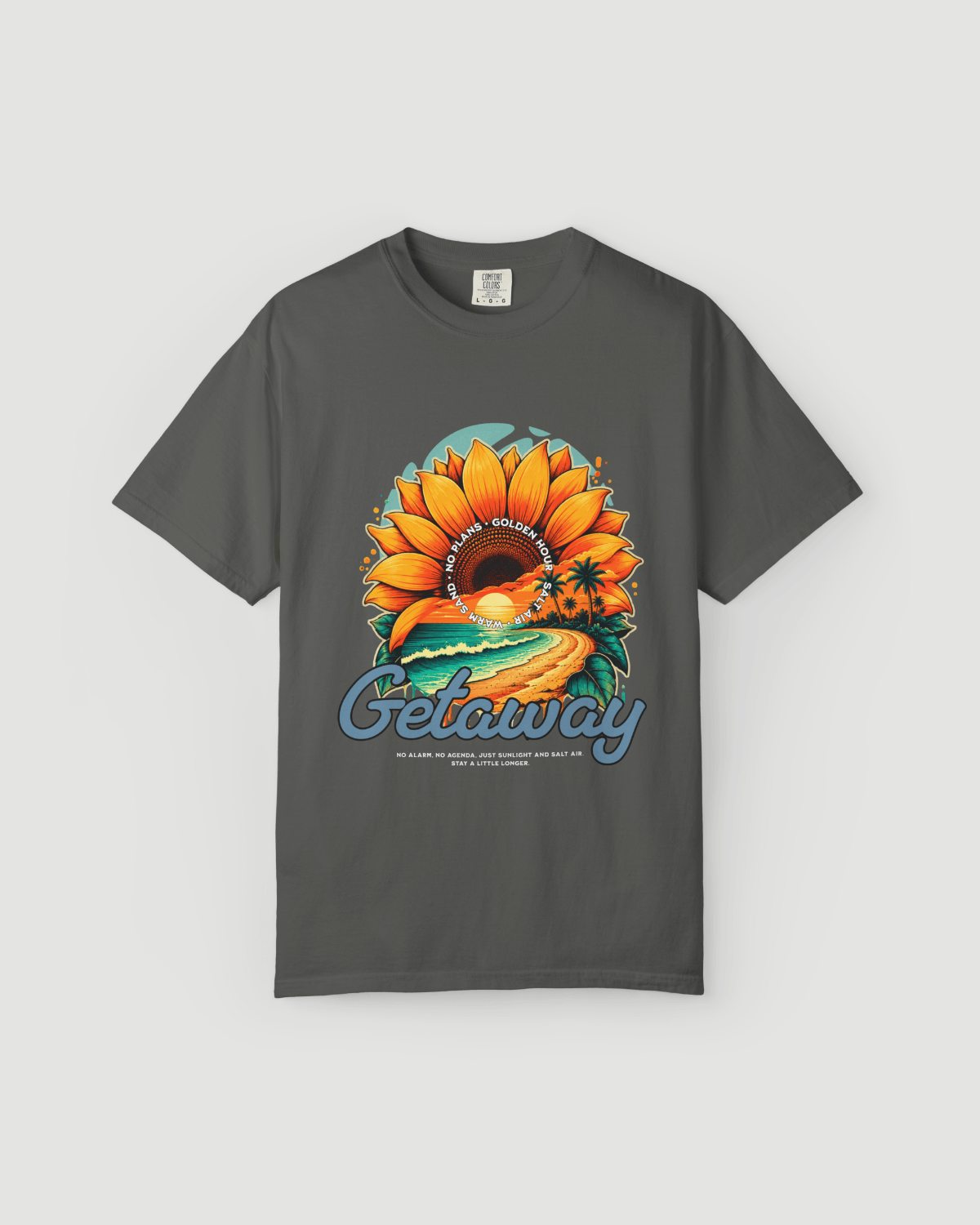 Getaway Sunflower Beach Tee – Pepper featuring a vibrant sunflower and coastal design on a dark tee.