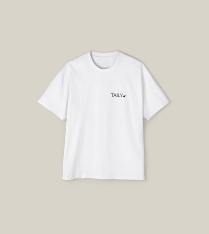 Create Impact Oversized Tee in white with TAILY graphic, embodying inner growth and transformation.