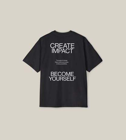Back view of the Create Impact oversized tee featuring strong typography and a motivational message.