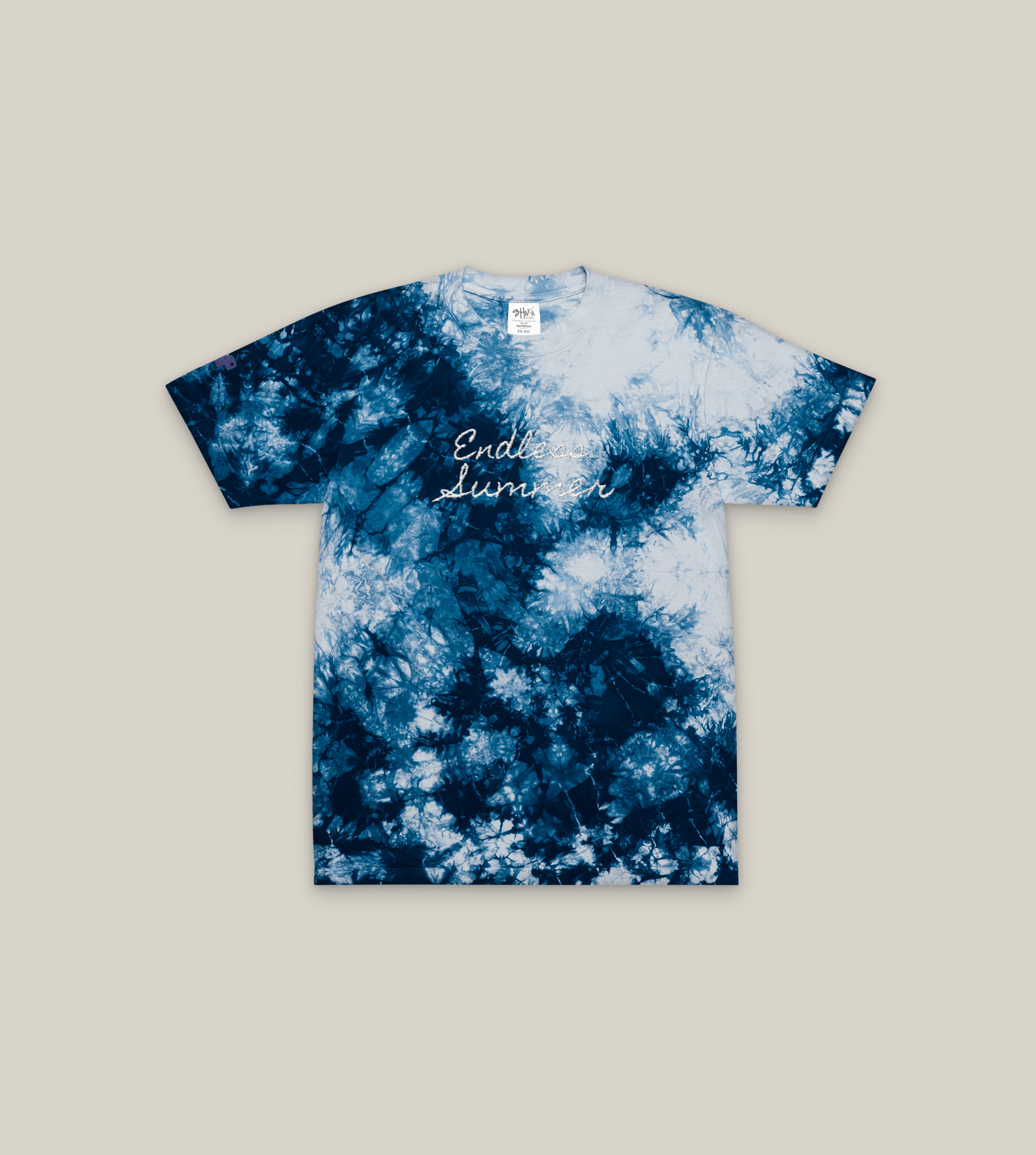 Endless Summer tie-dye oversized tee in blue tones with handwritten text and logo patch.