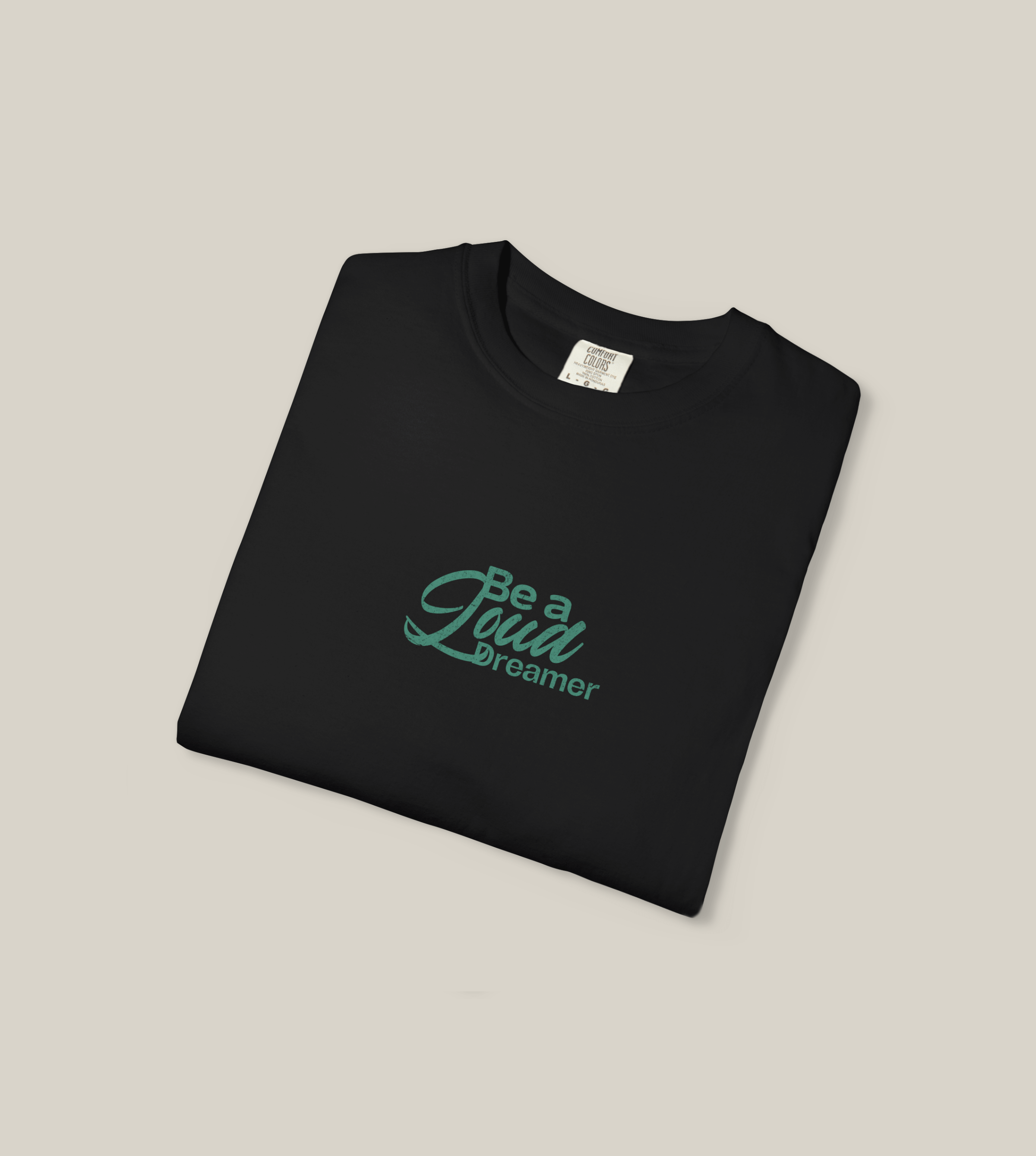 Be a Loud Dreamer Tee in black cotton featuring minimal script, perfect for stylish dreamers.
