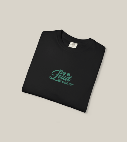 Be a Loud Dreamer Tee in black cotton featuring minimal script, perfect for stylish dreamers.