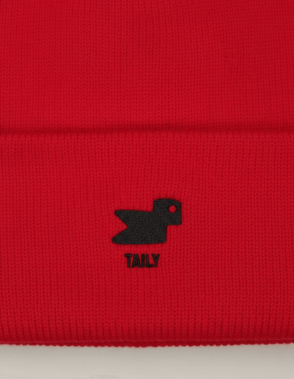 Taily Bird Knit Beanie in red featuring minimal embroidery and a small bird logo.
