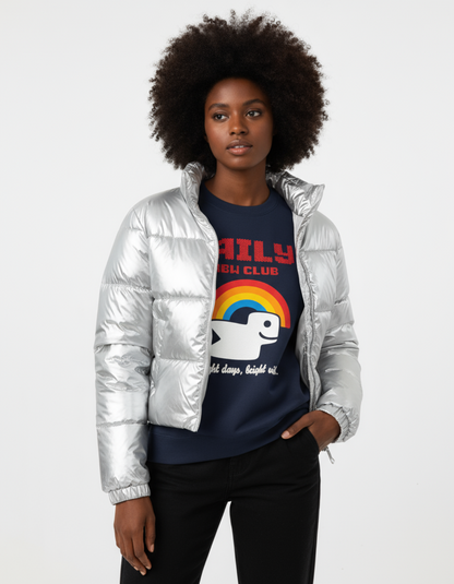 Woman wearing Taily RBW Club sweatshirt in Navy and a silver puffer jacket, showcasing vibrant rainbow graphic.