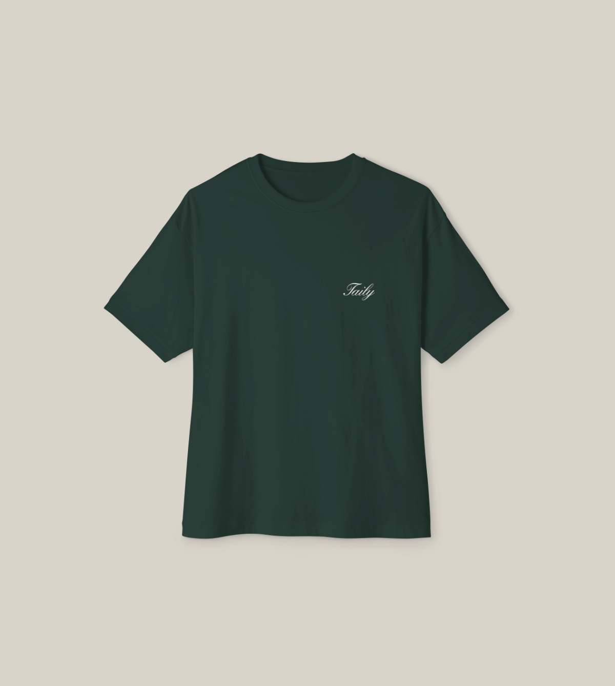 Lake Geneva Floral Oversized Tee in dark green with minimal logo on front, perfect for casual style.