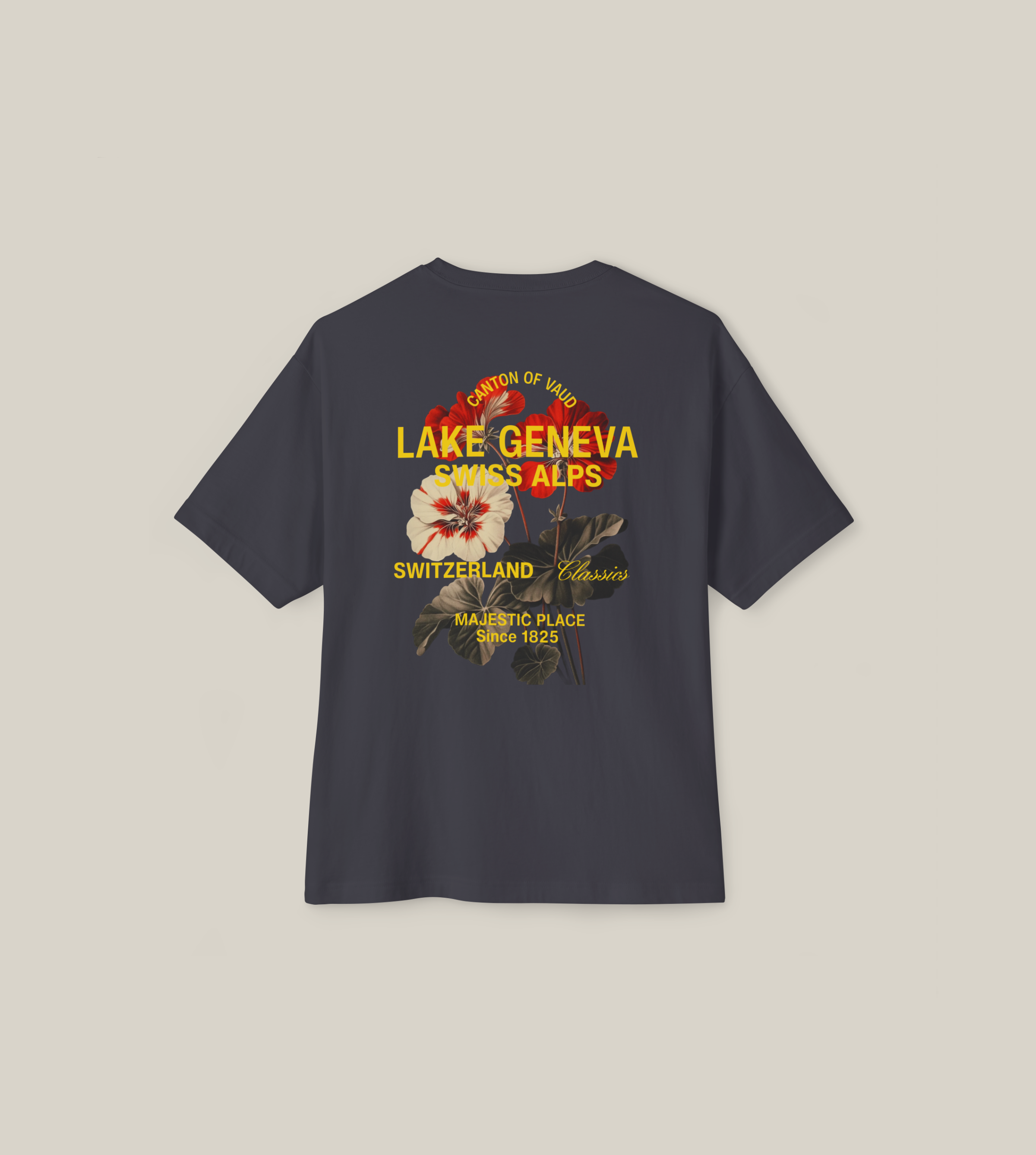 Dark grey boxy t-shirt featuring a floral back print with 'Lake Geneva Swiss Alps' design.
