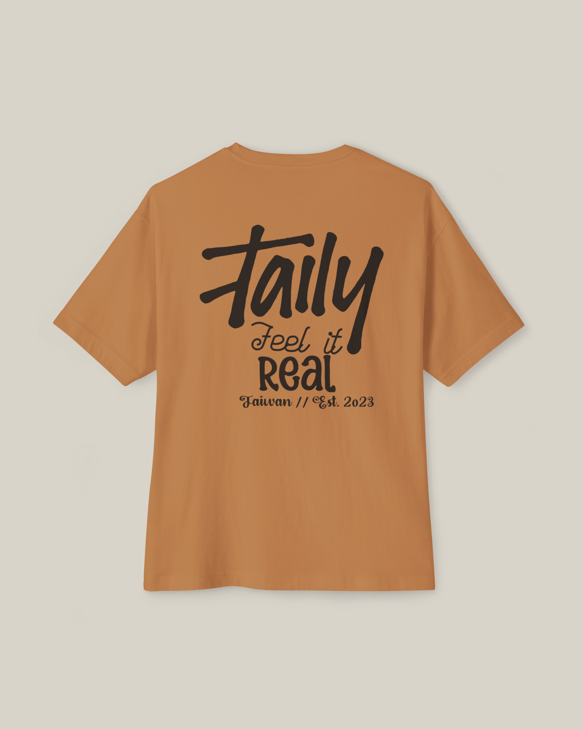 Taily Feel It Real Boxy Tee in toast color, featuring back lettering, a streetwear boxy t-shirt.