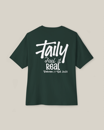 Taily Feel It Real boxy tee in forest green, showcasing chest logo and bold lettering, streetwear boxy t-shirt.