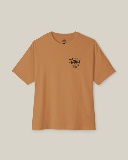 Taily Feel It Real Boxy Tee in toast, a streetwear boxy t-shirt featuring chest logo and bold lettering.