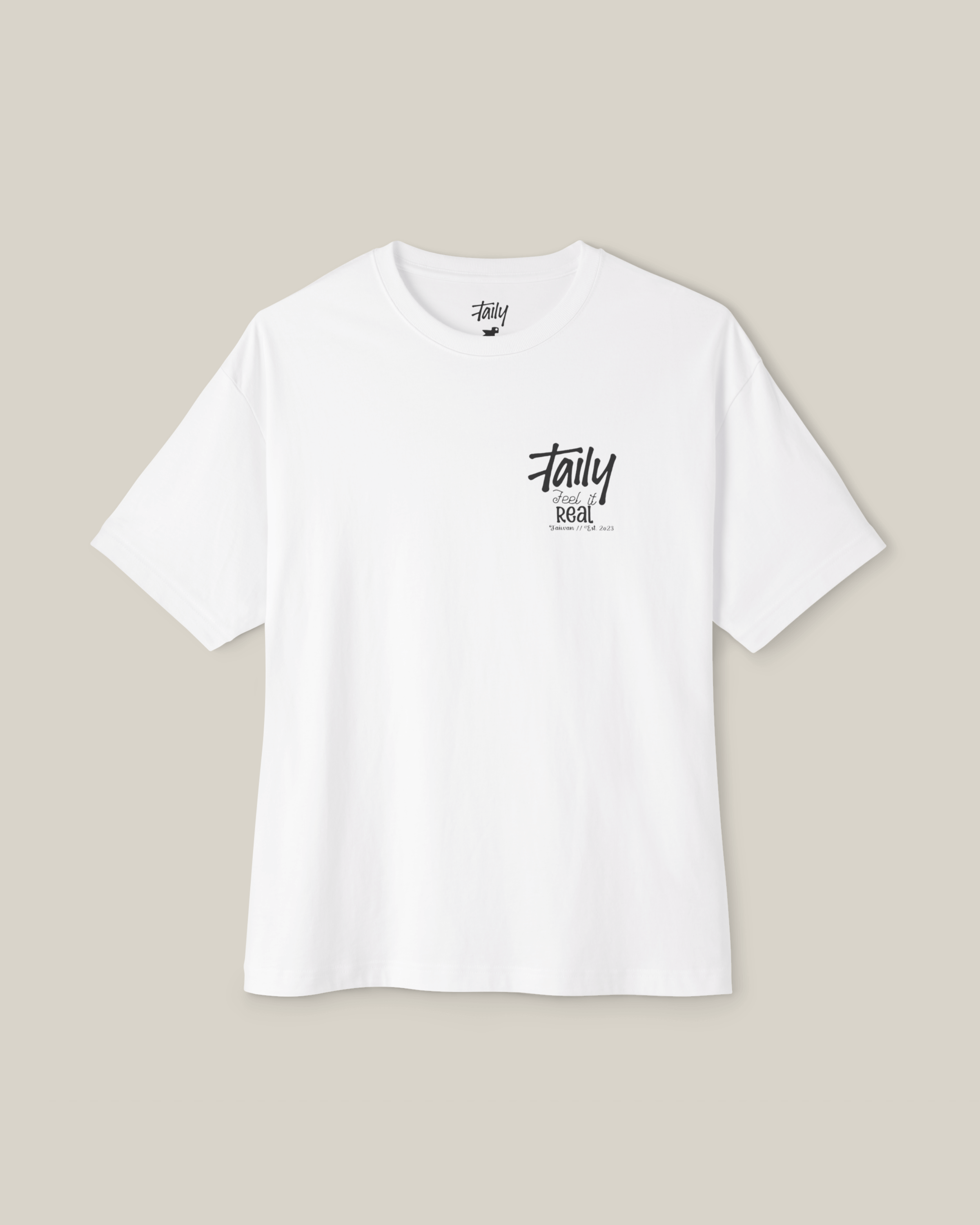 Taily Feel It Real Boxy Tee in white, featuring chest logo, a stylish streetwear boxy t-shirt design.