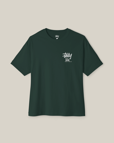 Taily Feel It Real boxy tee in forest green, a streetwear boxy t-shirt with chest logo and bold lettering.