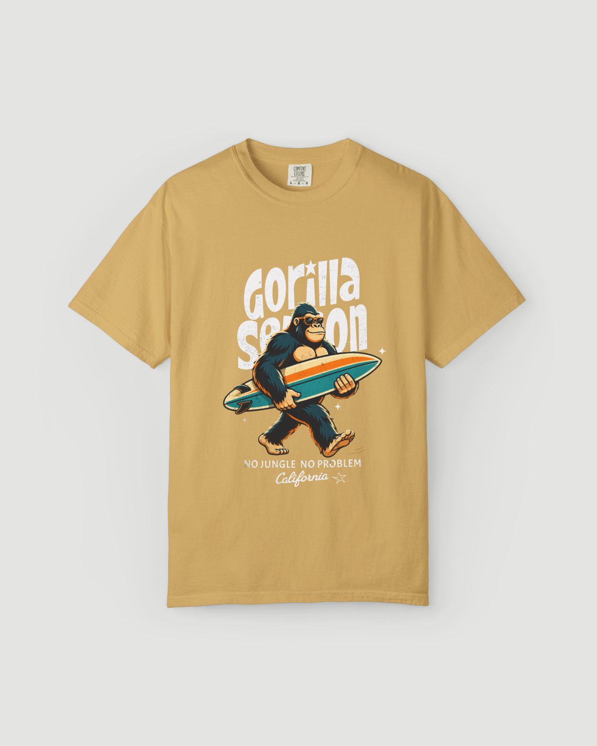 Gorilla Season Surf Tee – Mustard featuring a laid-back gorilla with a surfboard and California graphic.