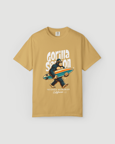 Gorilla Season Surf Tee – Mustard featuring a laid-back gorilla with a surfboard and California graphic.