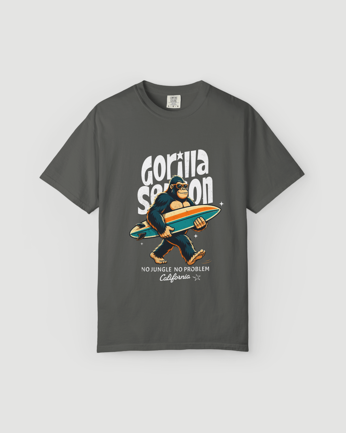 Gorilla Season Surf Tee – Pepper featuring a laid-back gorilla with a surfboard and bold California graphic.