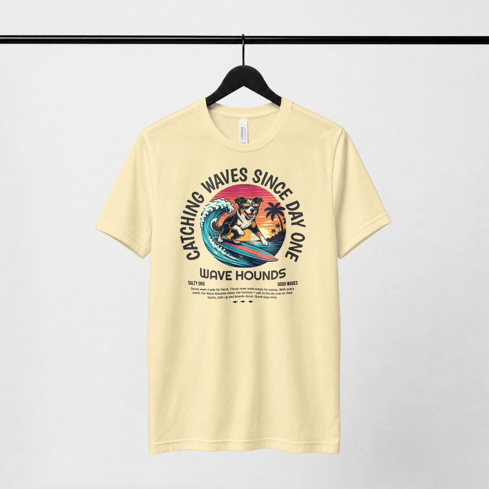 Wave Hounds Surf Tee – Banana featuring a retro surf graphic on a heavyweight tee in a light color