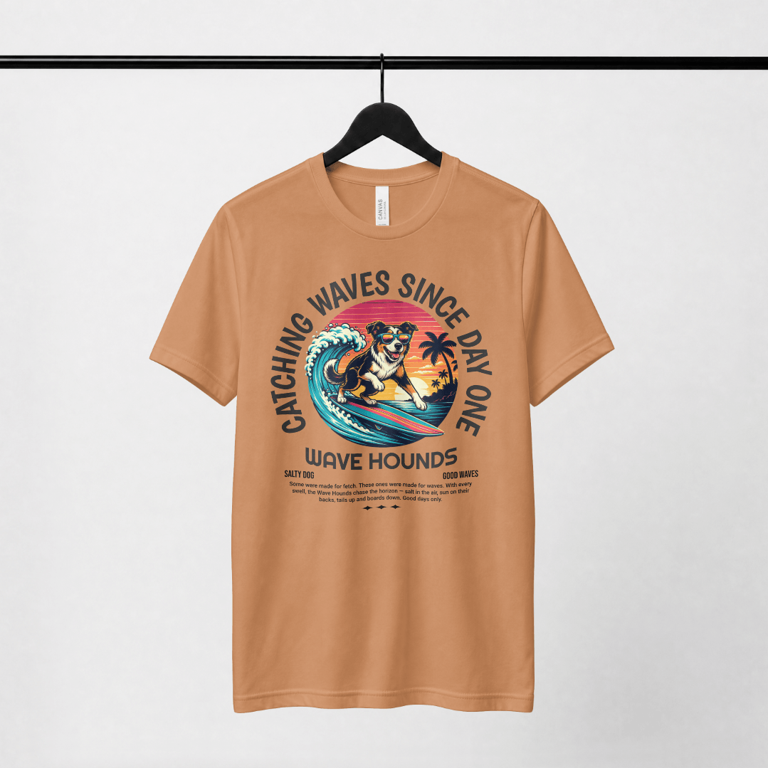 Wave Hounds Surf Tee – Yam featuring a retro graphic design of a dog surfing on a warm earthy burnt orange shirt.