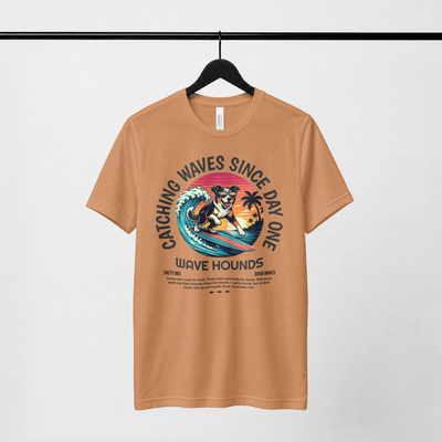 Wave Hounds Surf Tee – Yam featuring a retro graphic design of a dog surfing on a warm earthy burnt orange shirt.