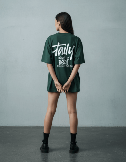 Taily Feel It Real Boxy Tee in forest green, featuring chest logo and bold lettering, streetwear boxy t-shirt.