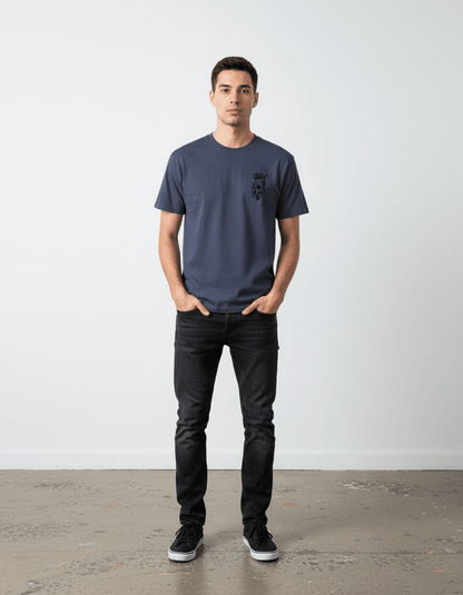 Model wearing Taily Rage streetwear graphic t-shirt in denim color, showcasing front logo design.