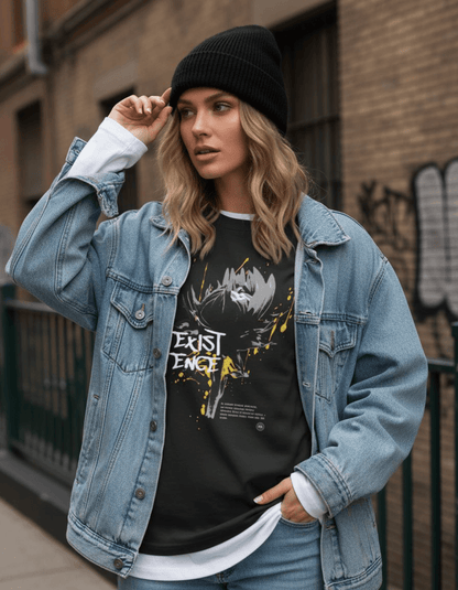 Young woman wearing the Taily “Existence” Streetwear Oversized T-Shirt in black, styled with a denim jacket and beanie.