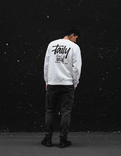 Model wearing Taily Feel It Real Sweatshirt, a streetwear graphic sweatshirt, featuring a logo on the chest and bold lettering on the back.
