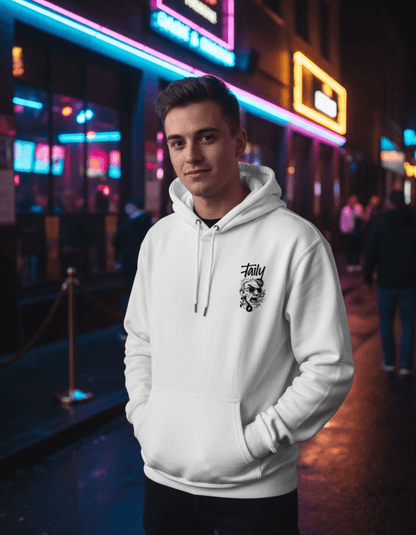 Taily Rage streetwear graphic hoodie in white worn by a model in an urban setting with neon lights.