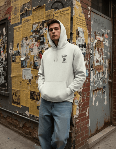 Model wearing Taily Wonders Vintage Graphic Hoodie in oatmeal color against a graffiti-covered wall.