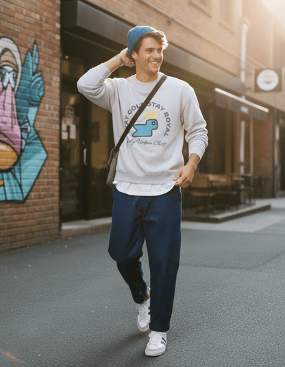 Taily Bird Stay Cold Stay Royal Streetwear Graphic Sweatshirt in grey worn casually by a man on a city street.
